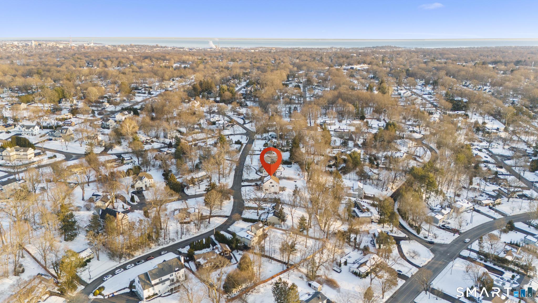 204 Glen Ridge Road Fairfield, CT 06825 - Photo 12 of 12 Surrounded by mature trees and set on a scenic stretch just moments from Lake Mohegan, neighborhood beaches, and downtown amenities, the setting feels tranquil and removed while remaining effortlessly connected.