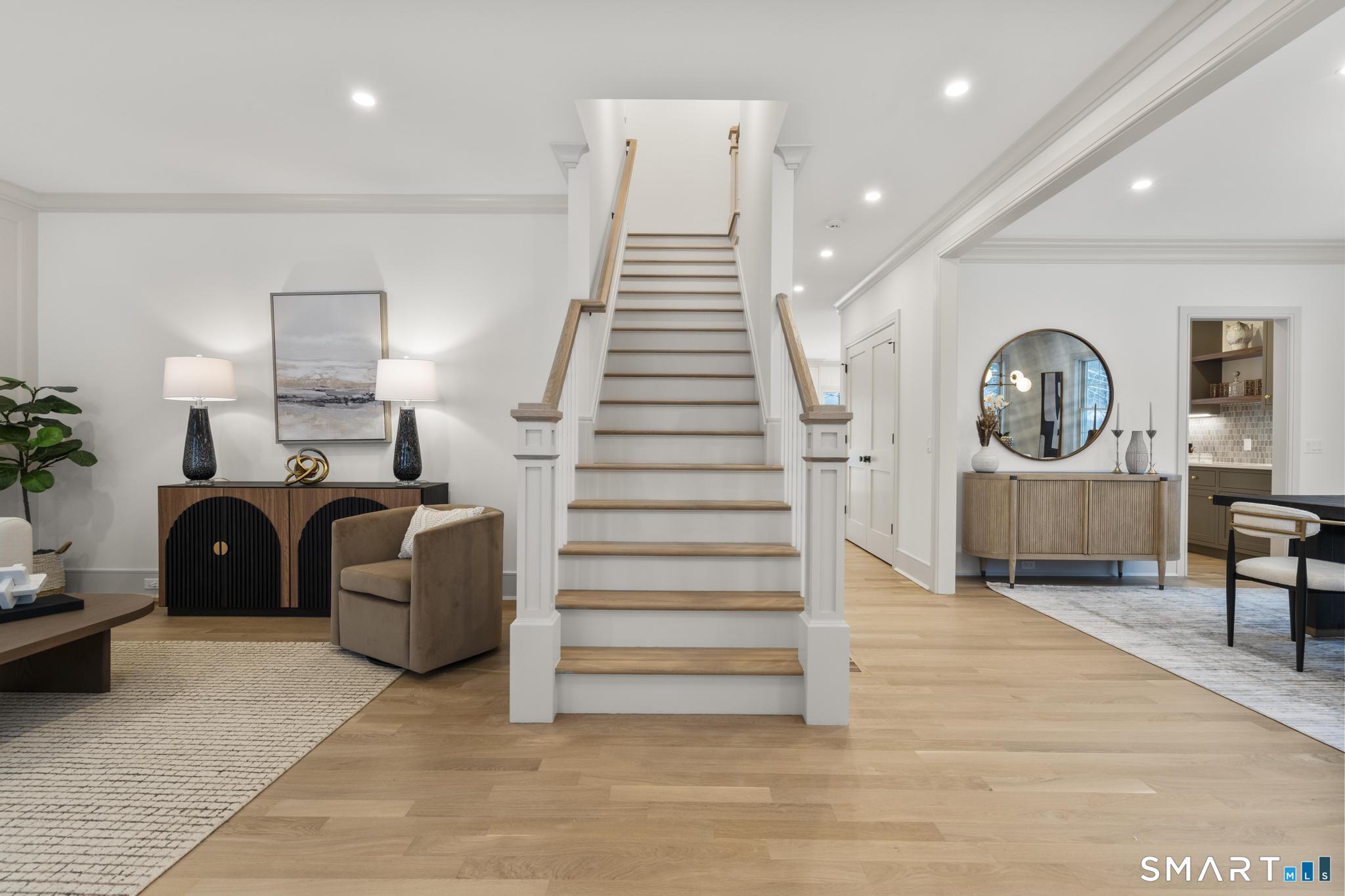 204 Glen Ridge Road Fairfield, CT 06825 - Photo 13 of 45 a living room with furniture and a wooden floor