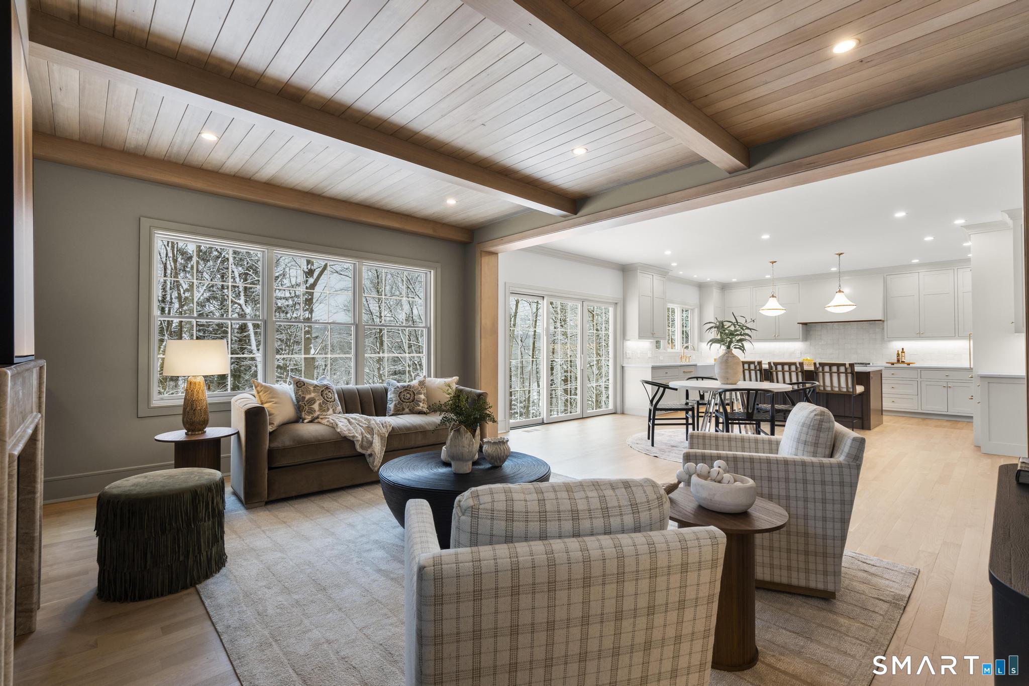 204 Glen Ridge Road Fairfield, CT 06825 - Photo 15 of 45 a living room with furniture and a large window