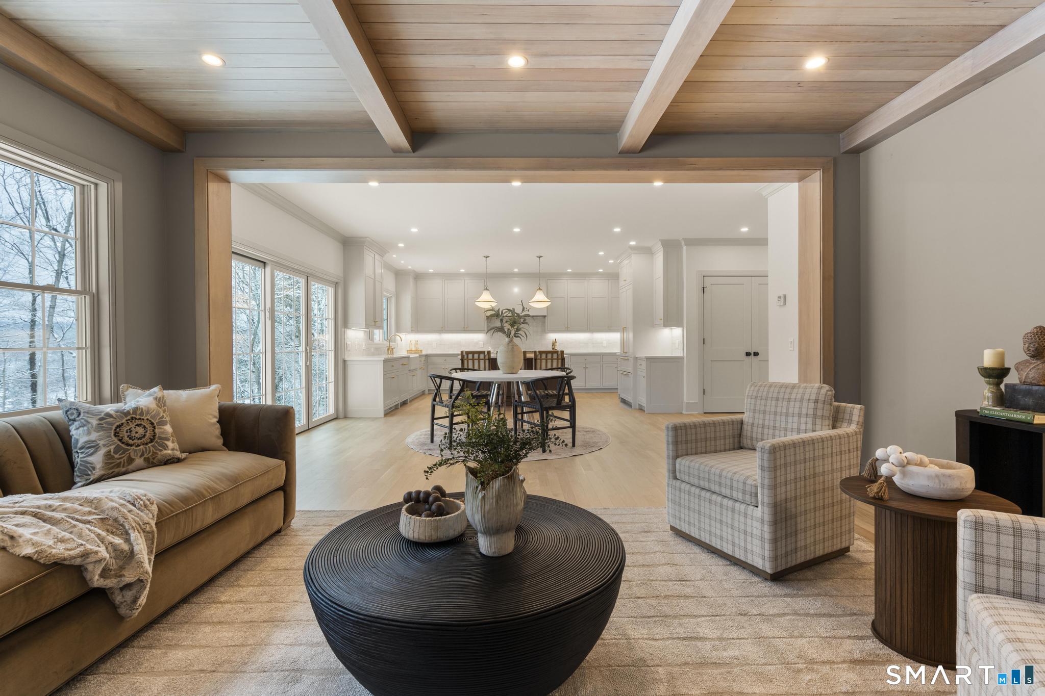 204 Glen Ridge Road Fairfield, CT 06825 - Photo 16 of 45 a living room with furniture and a large window