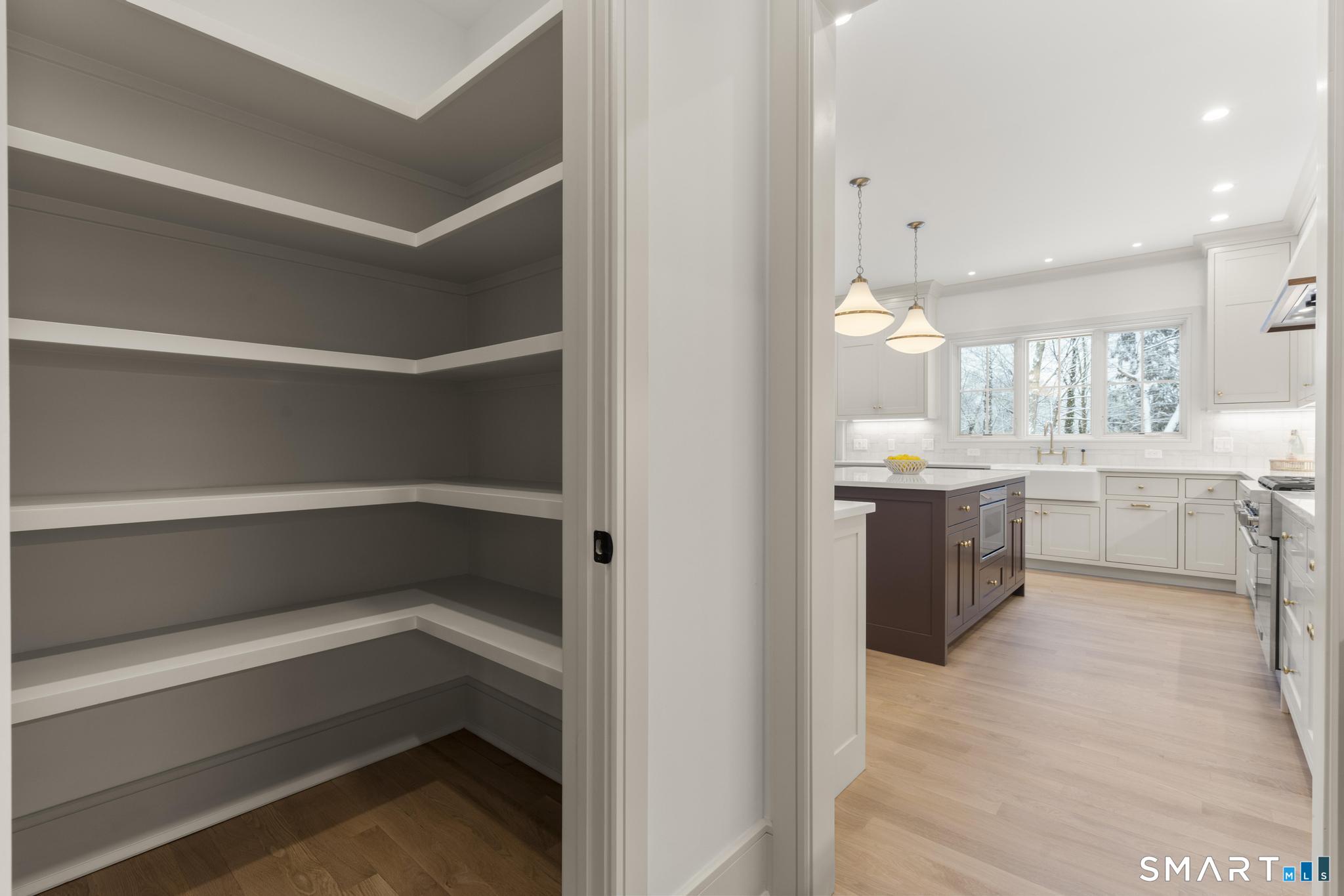 204 Glen Ridge Road Fairfield, CT 06825 - Photo 20 of 45 a kitchen with a refrigerator and a sink