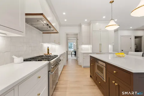 a spacious bathroom with a sink and mirror