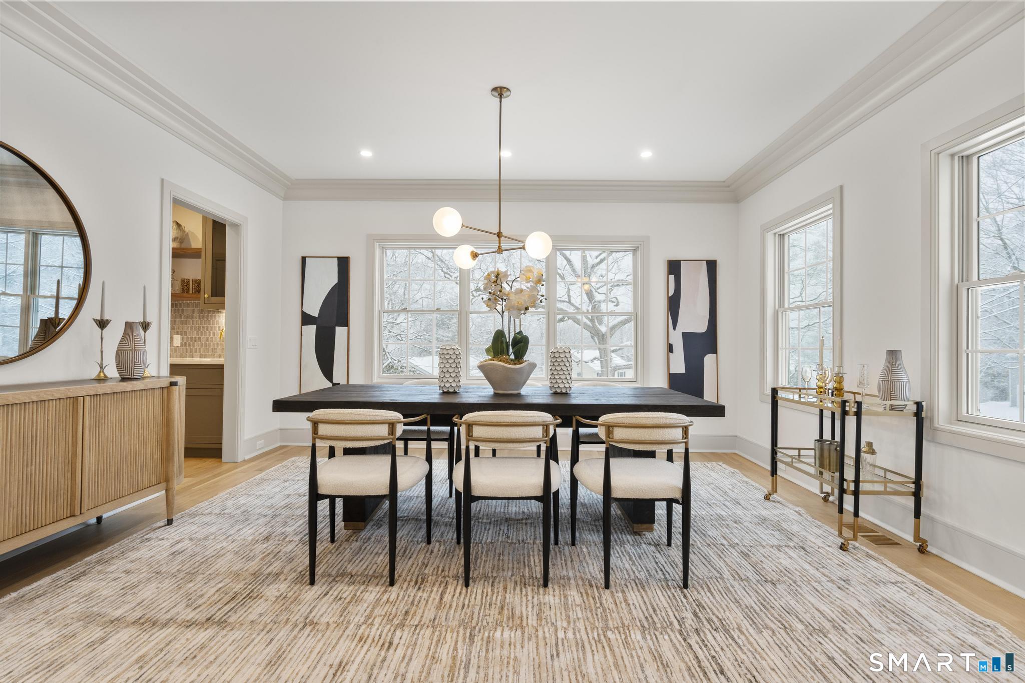 204 Glen Ridge Road Fairfield, CT 06825 - Photo 23 of 45 a view of a dining room with furniture window and wooden floor