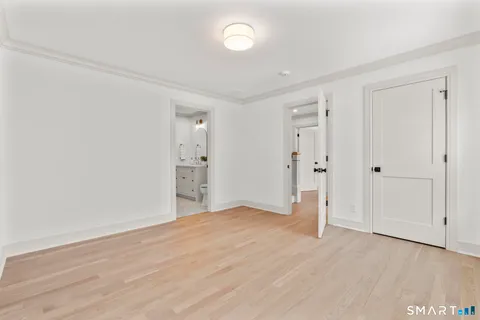 a bathroom with a toilet a sink and shower