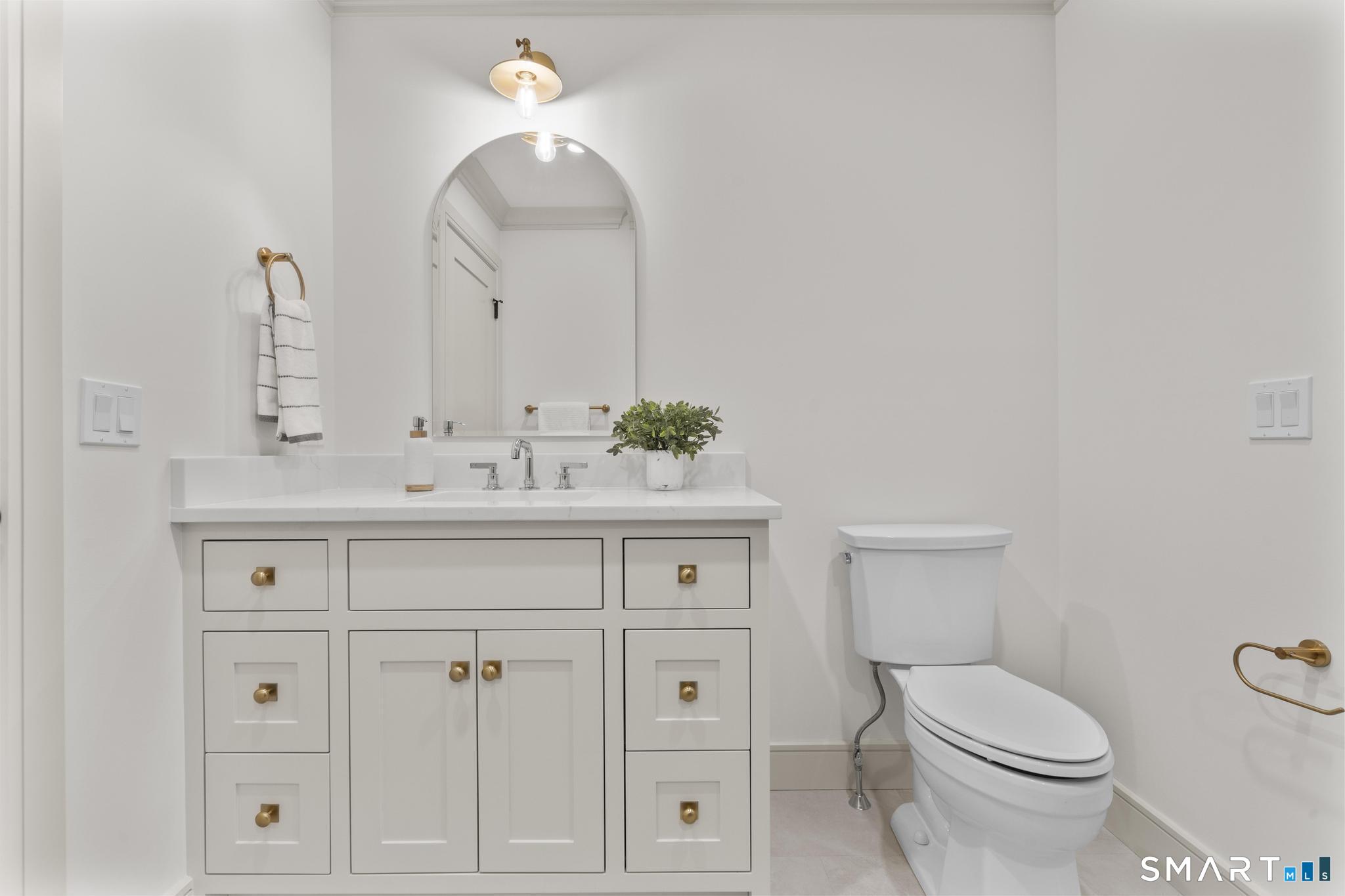 204 Glen Ridge Road Fairfield, CT 06825 - Photo 27 of 45 a bathroom with a sink vanity and a toilet