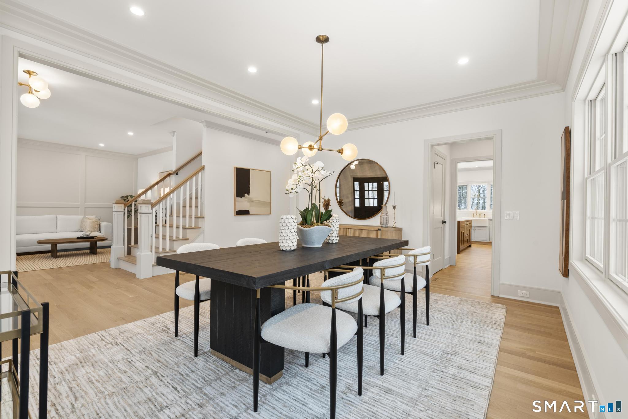 204 Glen Ridge Road Fairfield, CT 06825 - Photo 28 of 45 a view of a dining room with furniture and wooden floor