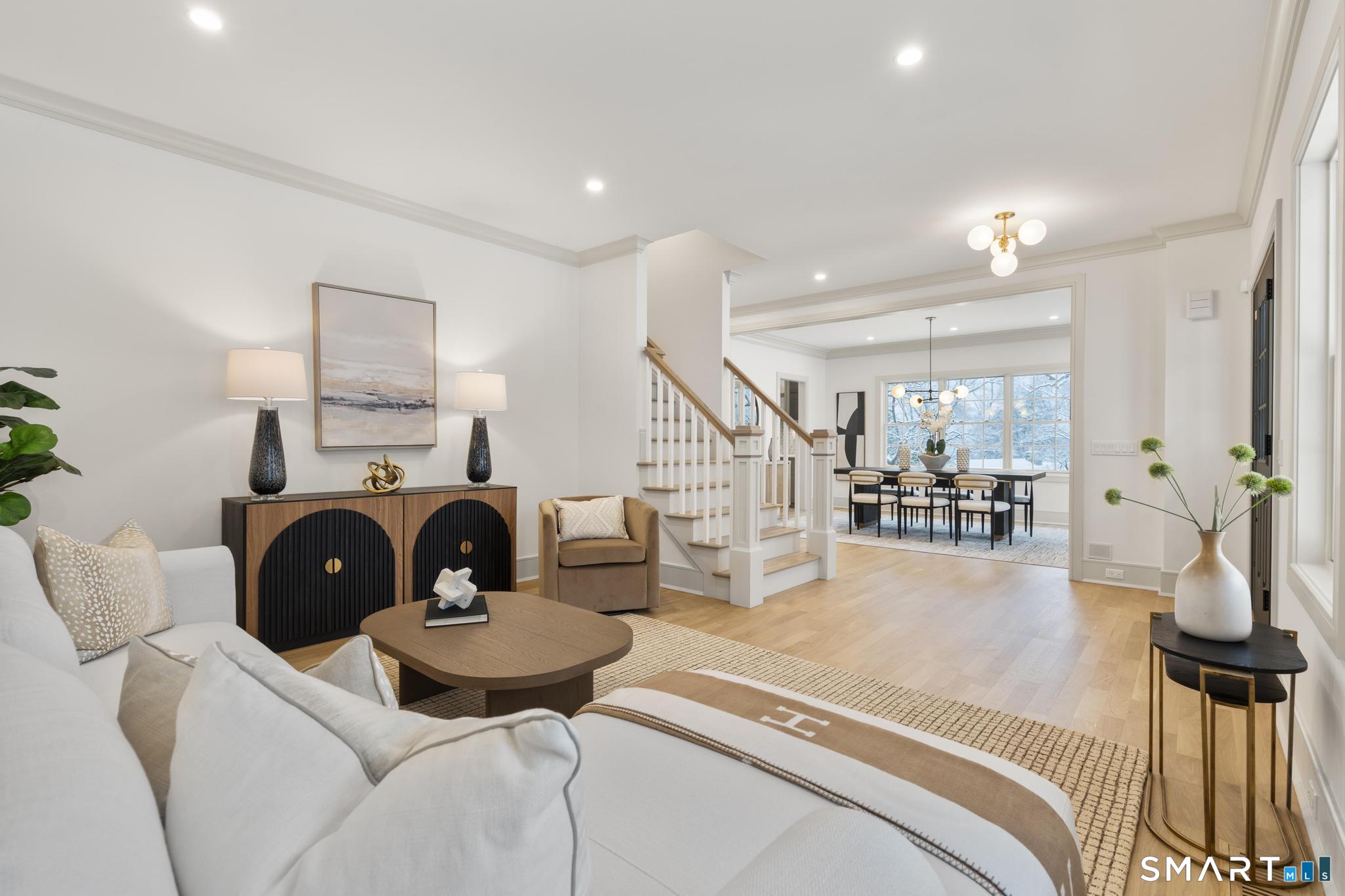 204 Glen Ridge Road Fairfield, CT 06825 - Photo 30 of 45 a living room with furniture and a fireplace