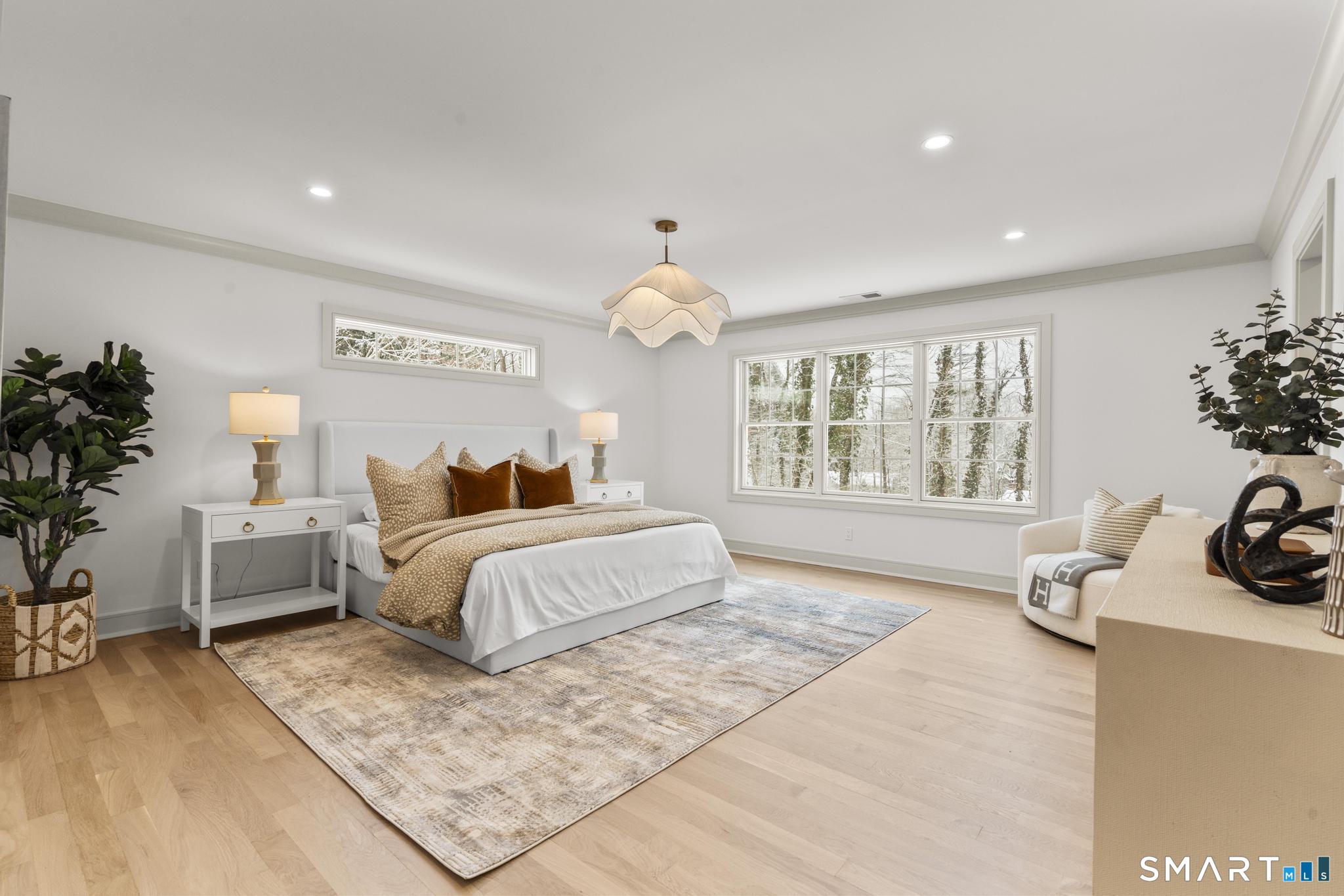 204 Glen Ridge Road Fairfield, CT 06825 - Photo 31 of 45 a spacious bedroom with a bed and a couch