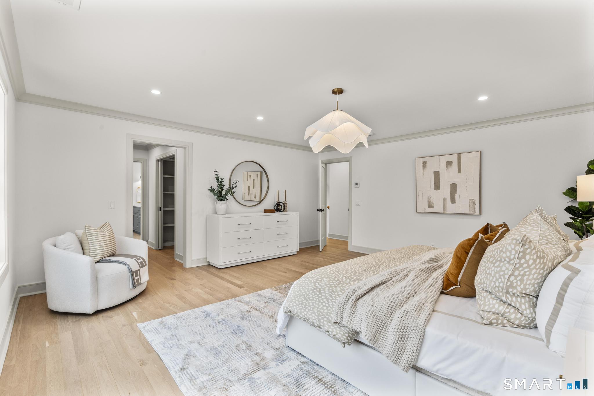 204 Glen Ridge Road Fairfield, CT 06825 - Photo 32 of 45 a bed room with a bed and a couch