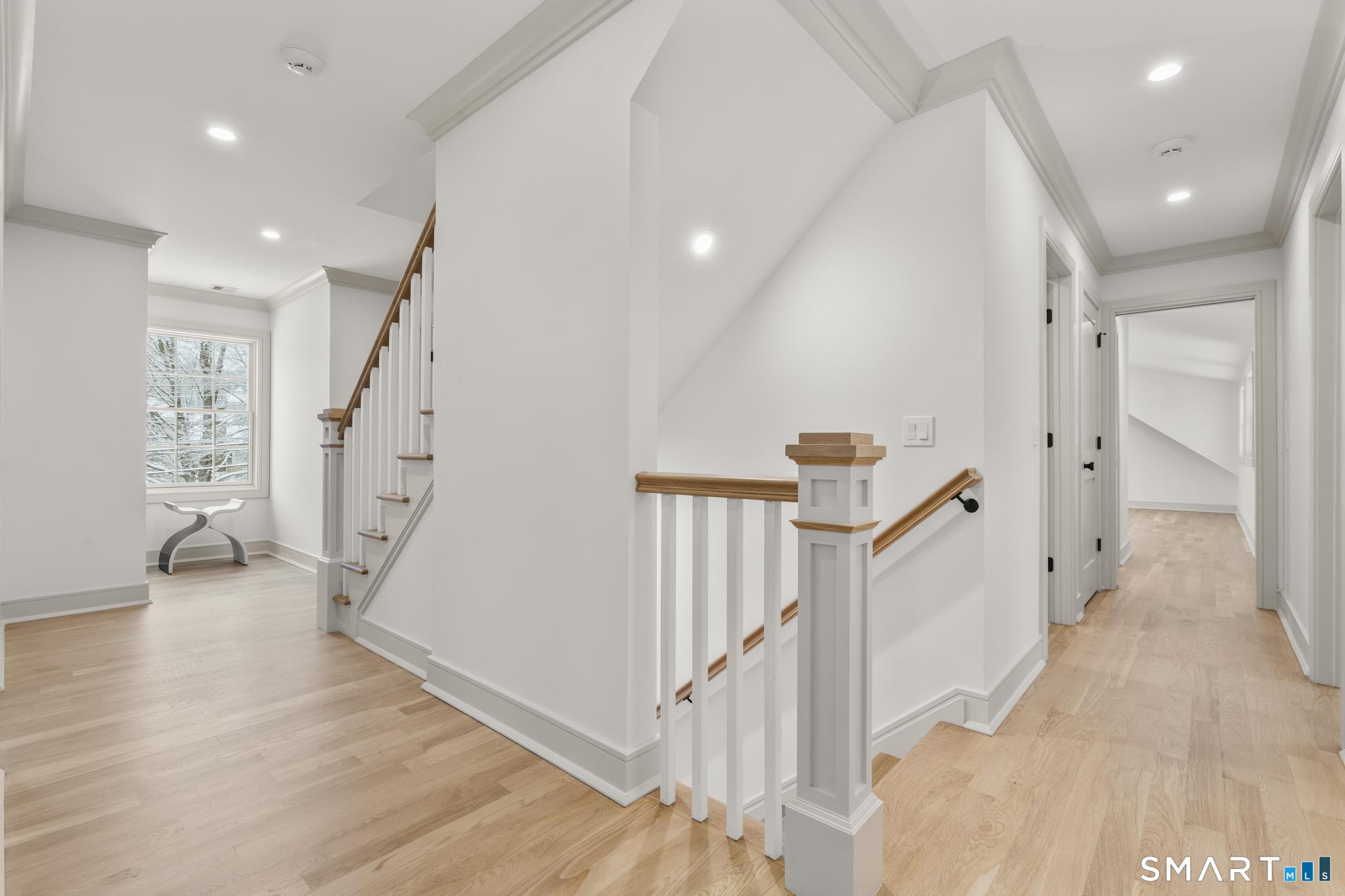204 Glen Ridge Road Fairfield, CT 06825 - Photo 39 of 45 a view of a hallway with wooden floor and entryway