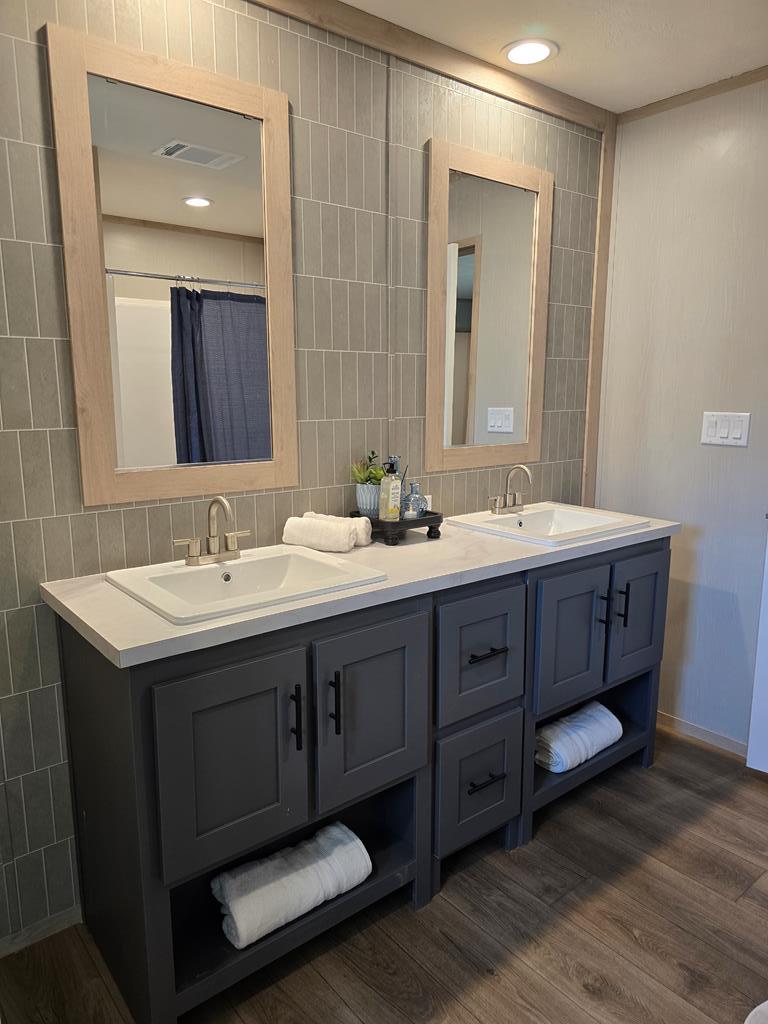 110 Deer Ridge Mason, TX 76856 - Photo 7 of 12 a bathroom with double vanity sink and a mirror