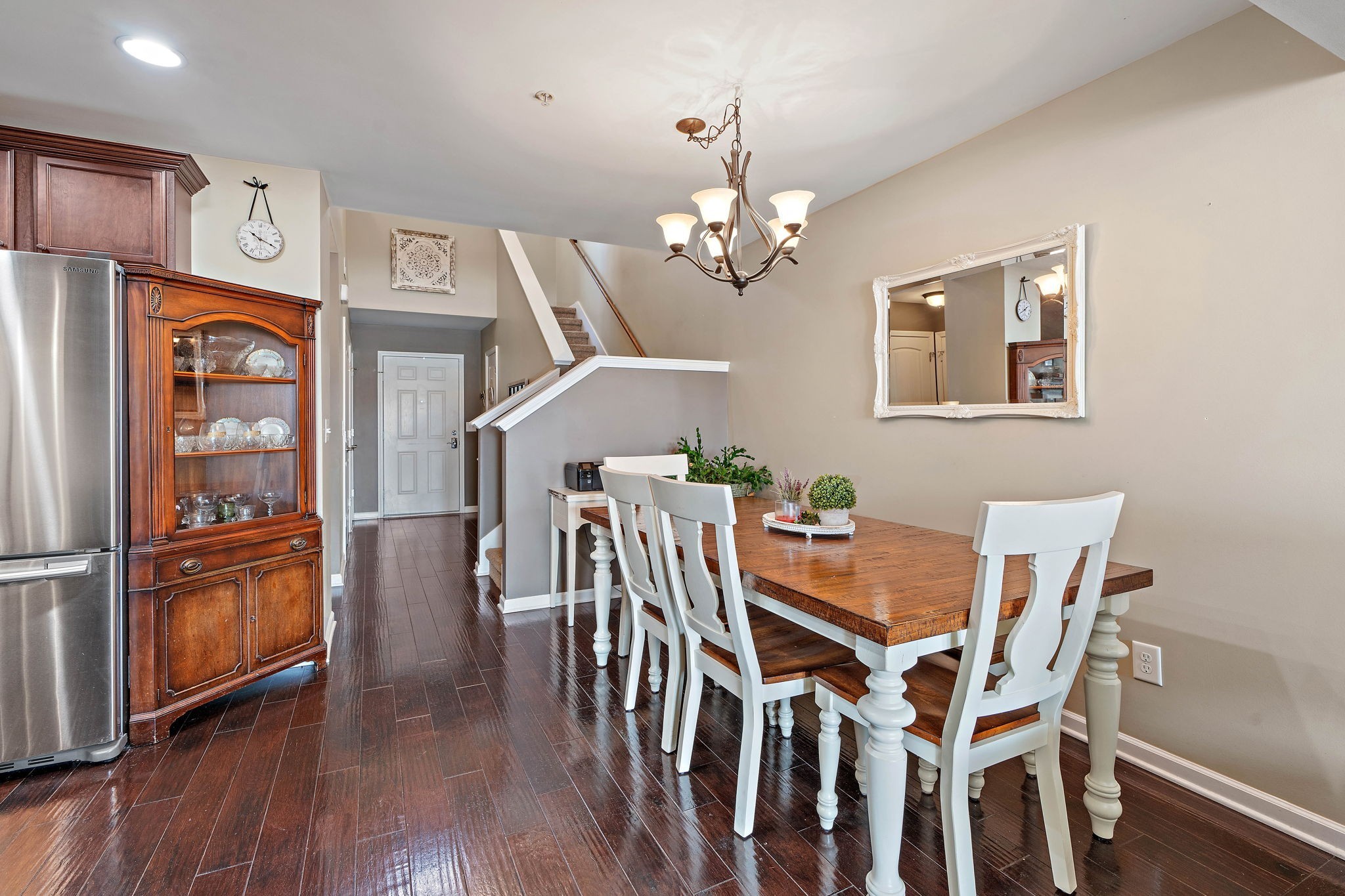 1071 Muna Court Spring Hill, TN 37174 - Photo 14 of 50 a dining room with furniture a chandelier and wooden floor