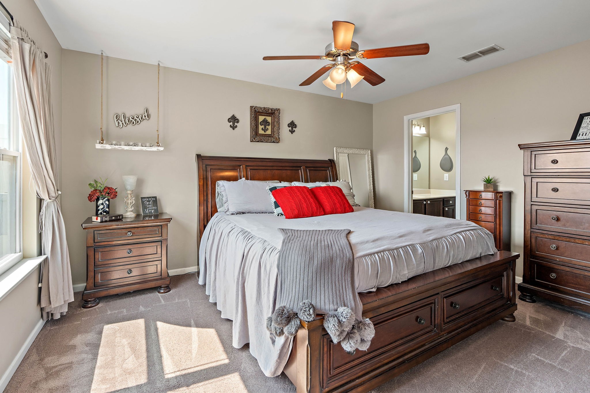 1071 Muna Court Spring Hill, TN 37174 - Photo 17 of 50 a bedroom with a bed and a chandelier