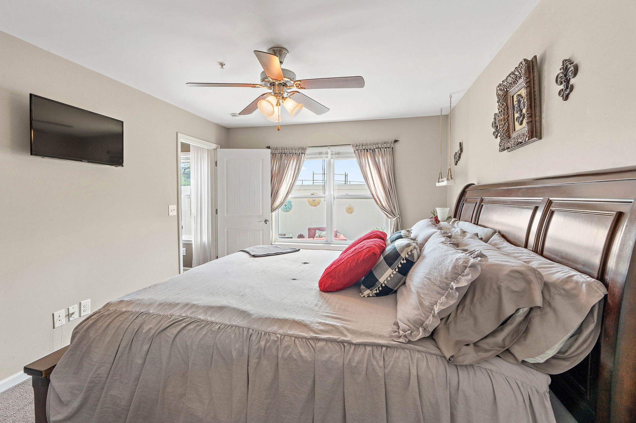 1071 Muna Court Spring Hill, TN 37174 - Photo 19 of 50 a bedroom with a bed and a chandelier