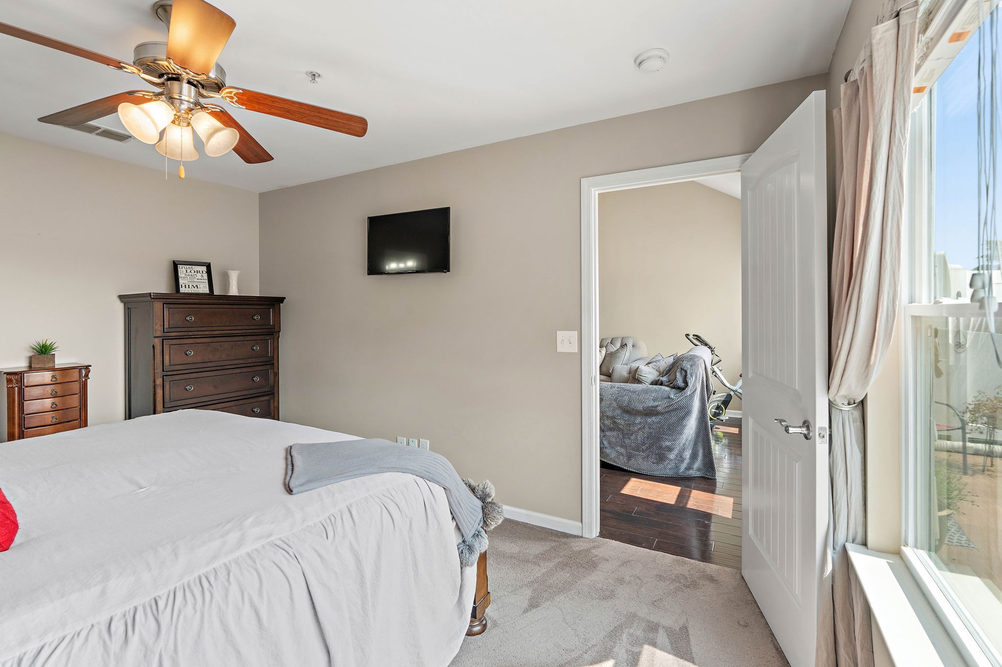 1071 Muna Court Spring Hill, TN 37174 - Photo 20 of 50 a bedroom with a bed and a chandelier