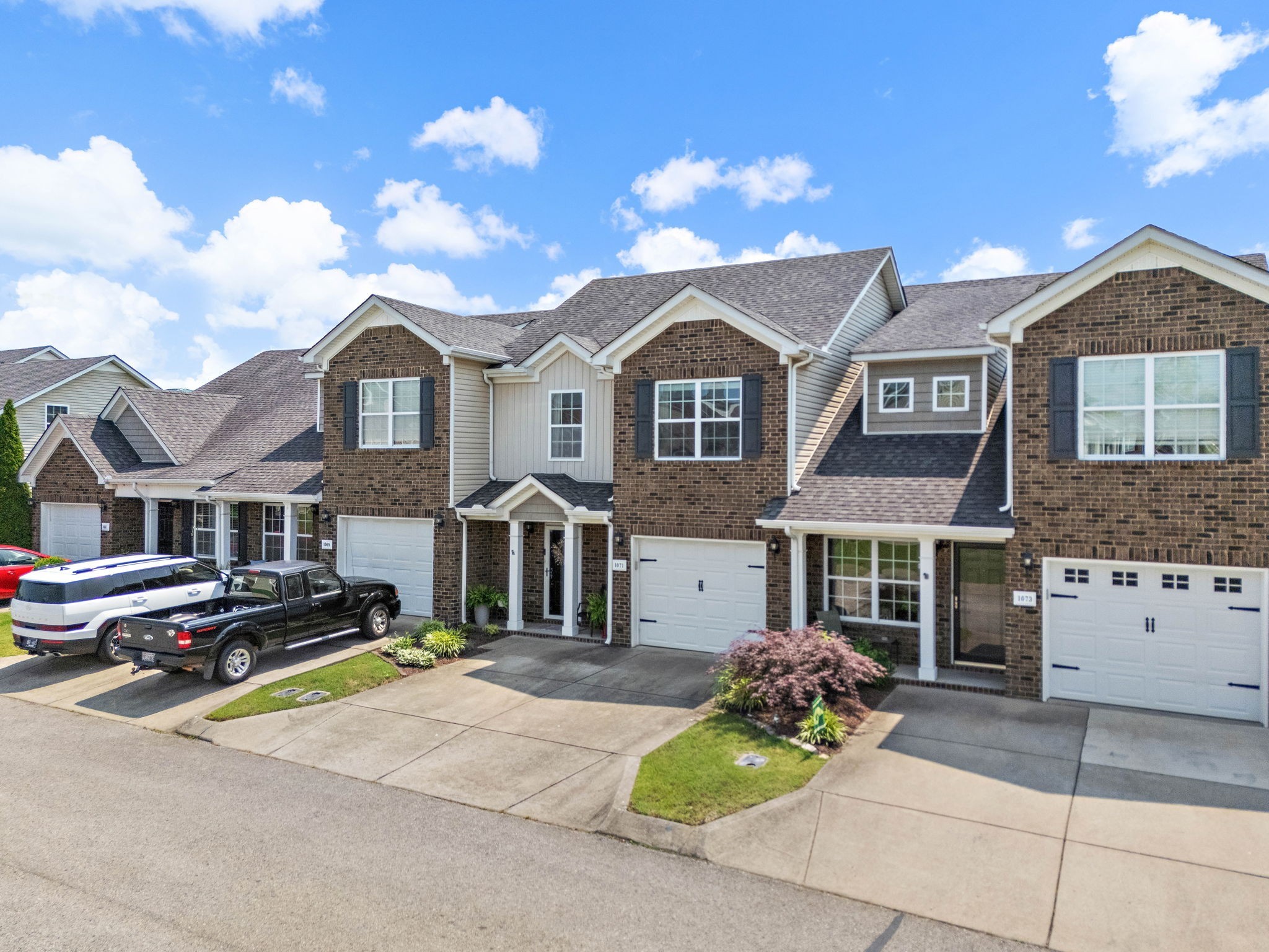 1071 Muna Court Spring Hill, TN 37174 - Photo 37 of 50 a front view of a house with a garden