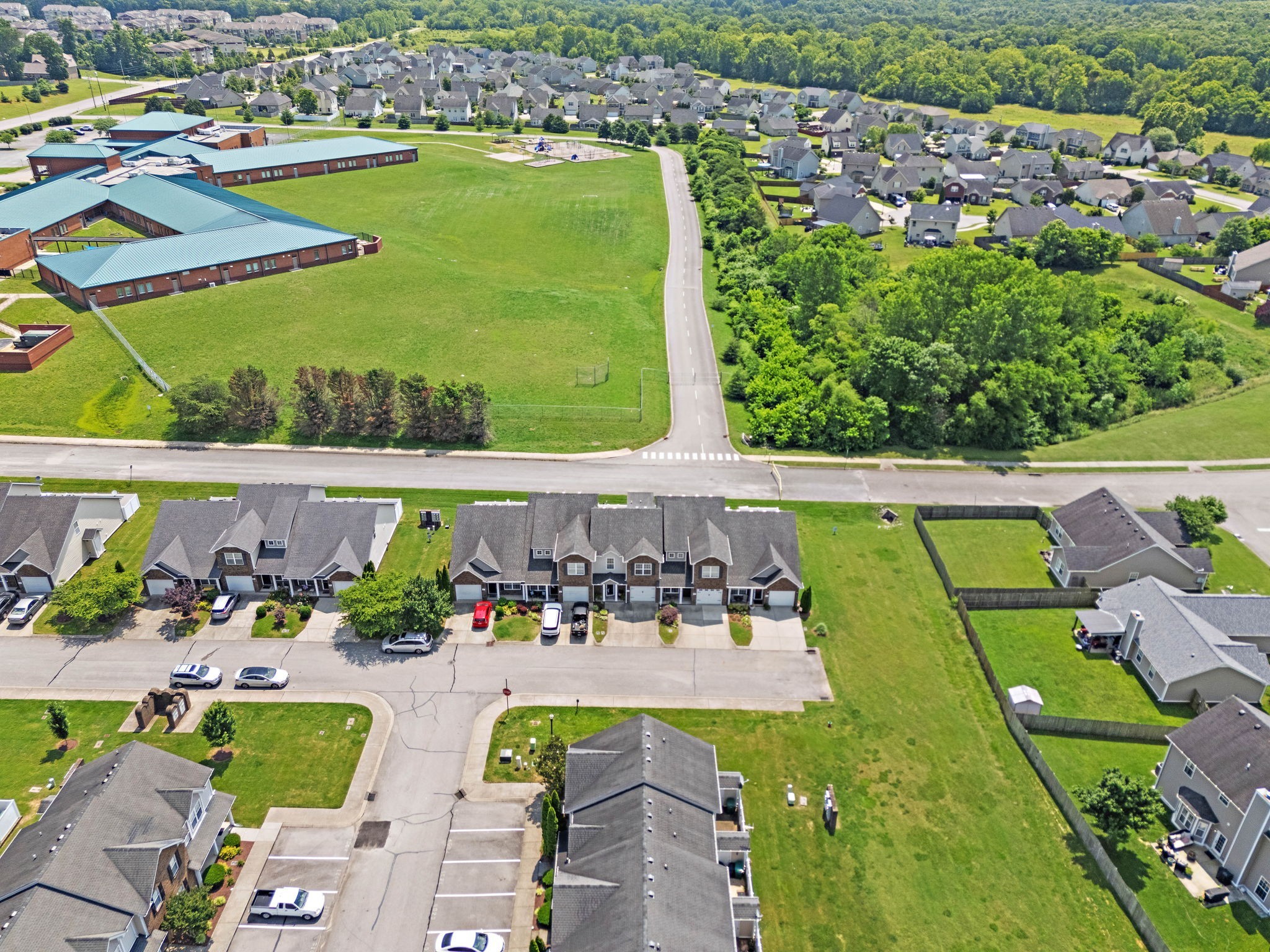 1071 Muna Court Spring Hill, TN 37174 - Photo 42 of 50 an aerial view of a house with a swimming pool