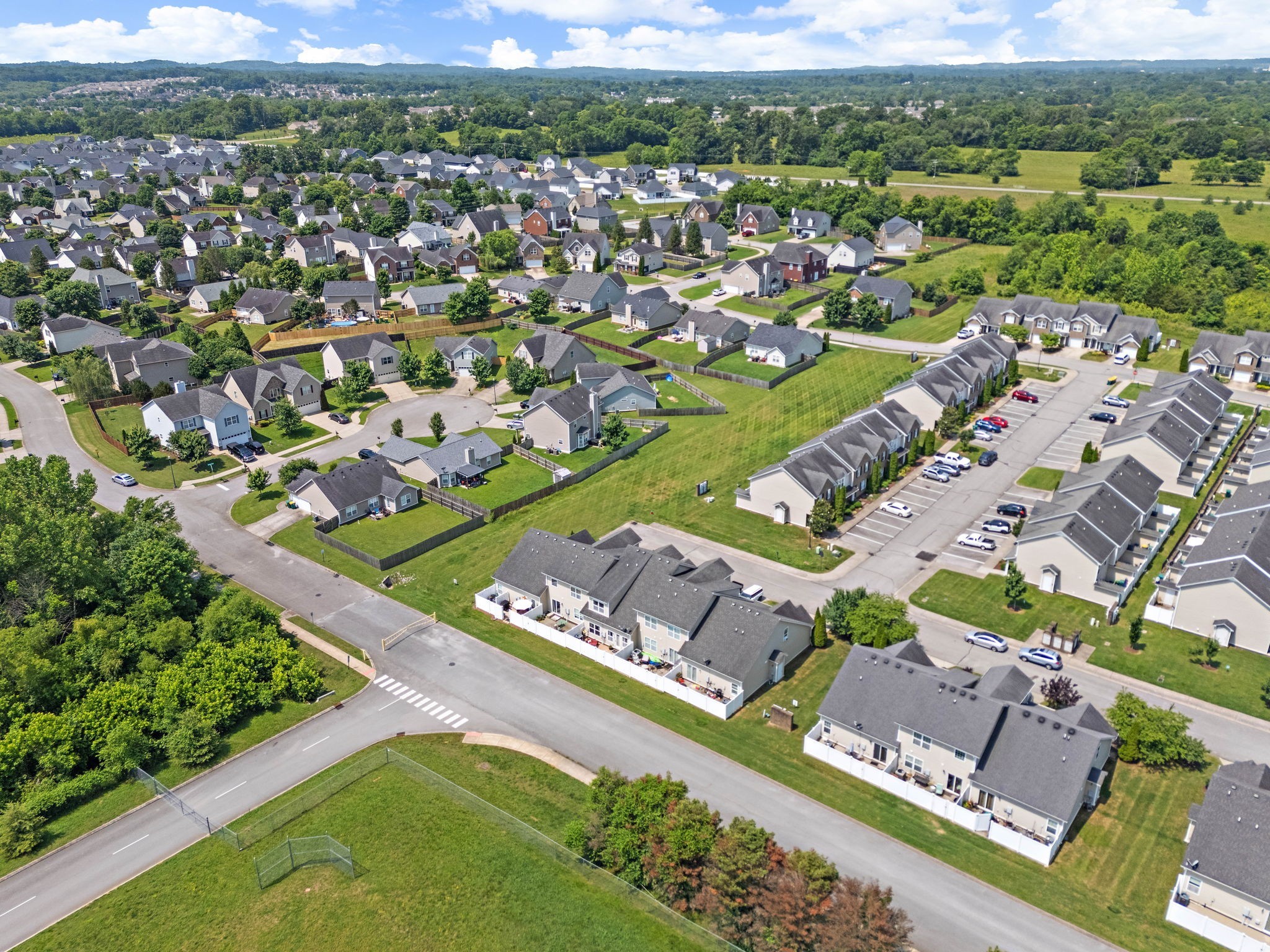 1071 Muna Court Spring Hill, TN 37174 - Photo 46 of 50 an aerial view of a city with lots of residential buildings