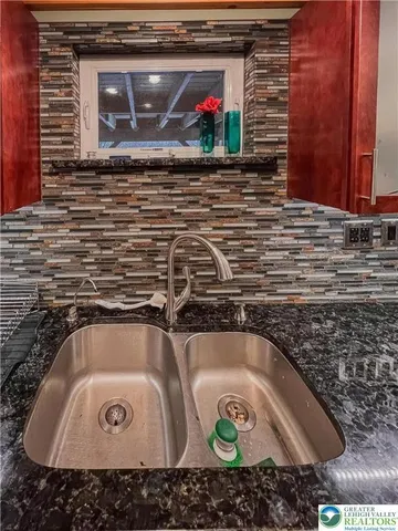 a bathroom with a sink and mirror