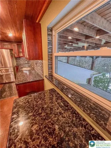 a view of a back yard of a house