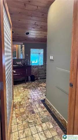 a bathroom with shower and bathtub
