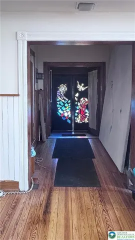 a view of empty room with window and fireplace