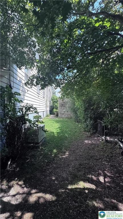 608 McKinley Street Hazleton, PA 18201 - Photo 49 of 59 a view of a yard with plants and large trees