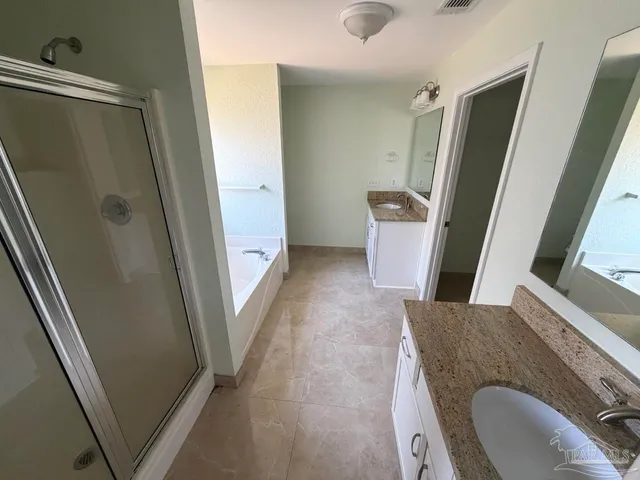 a view of a bathroom with a sink and tub
