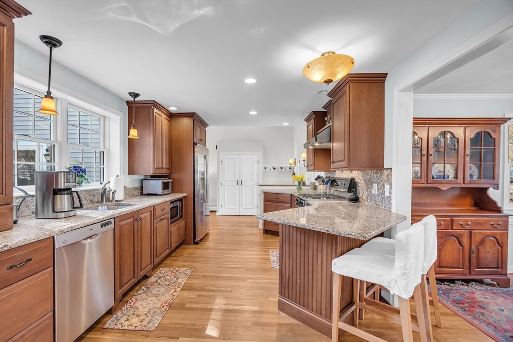 3 Notre Dame Road Acton, MA 01720 - Photo 6 of 35 a kitchen with counter and chairs