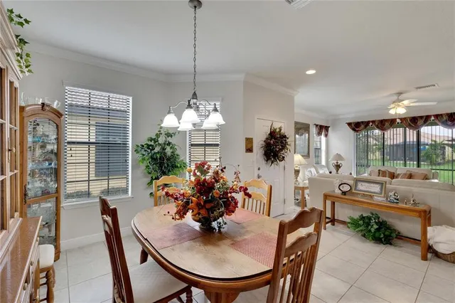 a view of a dining room and livingroom furniture and chandelier