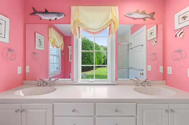 a view of a hallway with a livingroom and a bedroom