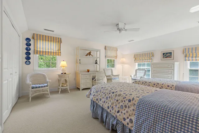 a bedroom with a bed and a table in it