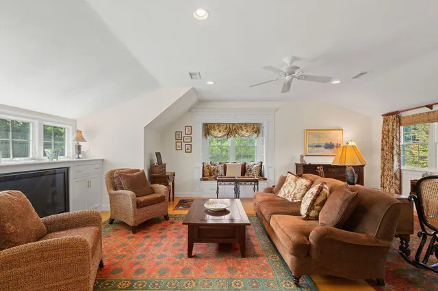 a view of an entryway with wooden floor
