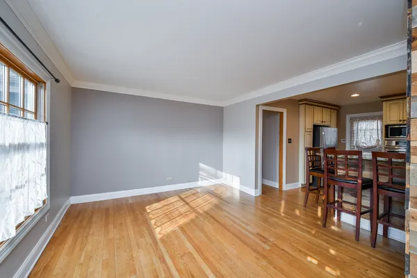a room with wooden floor and furniture