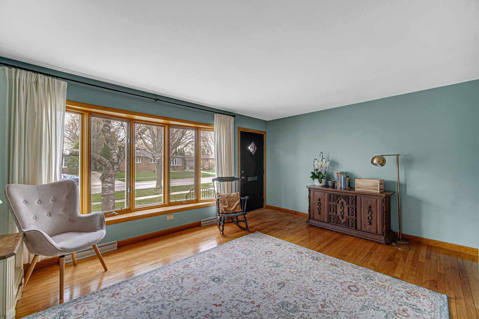 1202 Birch Drive Mount Prospect, IL 60056 - Photo 2 of 22 a living room with furniture and a window