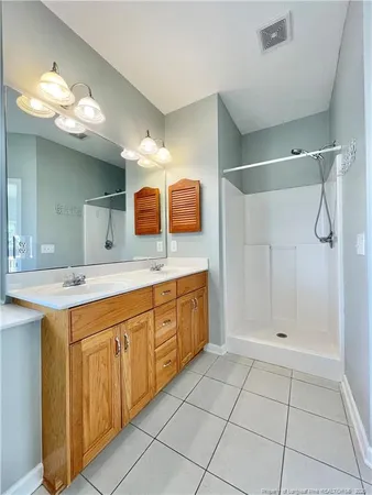 a view of a room with a hallway and a bathroom