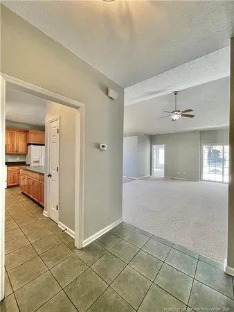 a view of a big room with windows and cabinet
