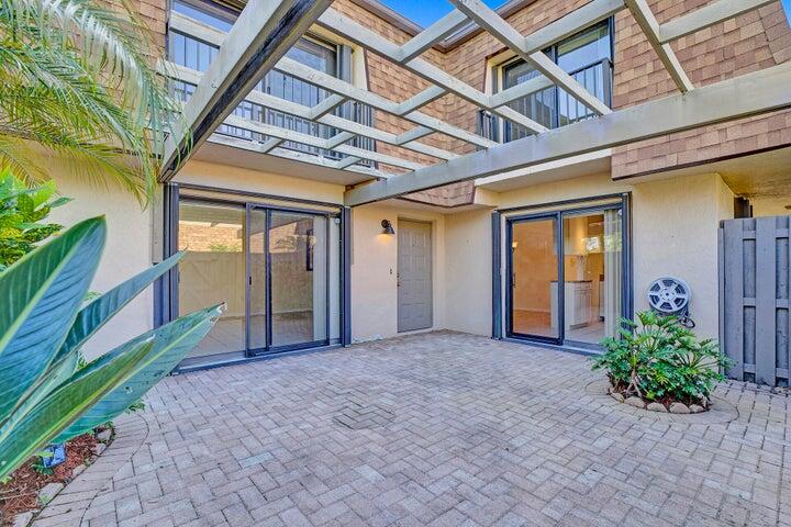 3134 Southwest 20th Terrace, Unit 11D Delray Beach, FL 33445 - Photo 11 of 14 a view of an entrance of the house