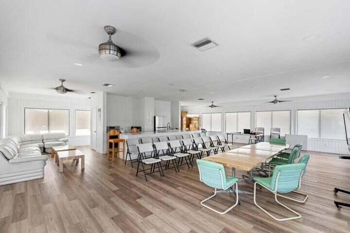 3134 Southwest 20th Terrace, Unit 11D Delray Beach, FL 33445 - Photo 9 of 14 a living room with lots of furniture and kitchen view