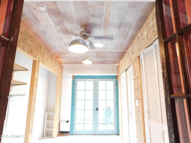 a outdoor space with lots of furniture and wooden floor