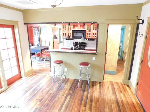 a kitchen with stainless steel appliances granite countertop a sink and a stove