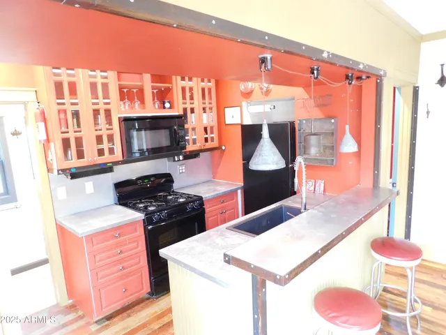 a kitchen with a sink and a vanity