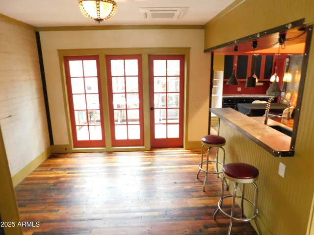 a bathroom with a toilet and a mirror