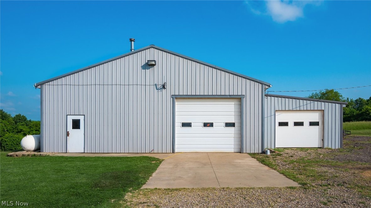 9393 Pioneer Road Byesville, OH 43723 - Photo 29 of 35 Garage featuring a yard