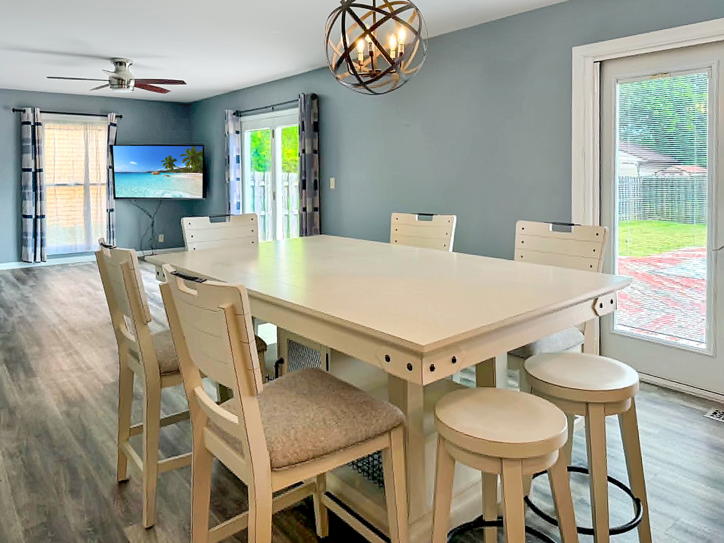 1008 Ascot Drive Rantoul, IL 61866 - Photo 5 of 24 a view of a dining room with furniture a chandelier and wooden floor