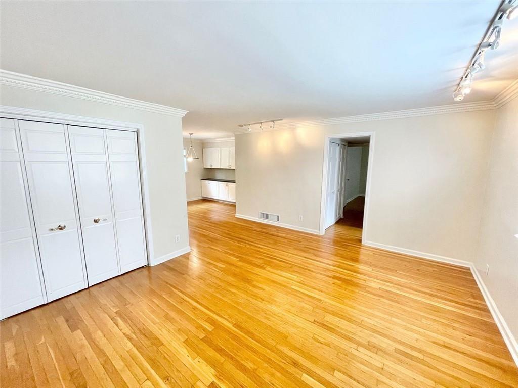 3660 Peachtree Road, Unit C3 Atlanta, GA 30319 - Photo 2 of 21 a view of an empty room with wooden floor