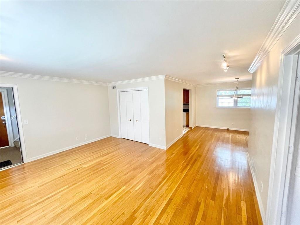3660 Peachtree Road, Unit C3 Atlanta, GA 30319 - Photo 3 of 21 a view of a big room with wooden floor and brick walls