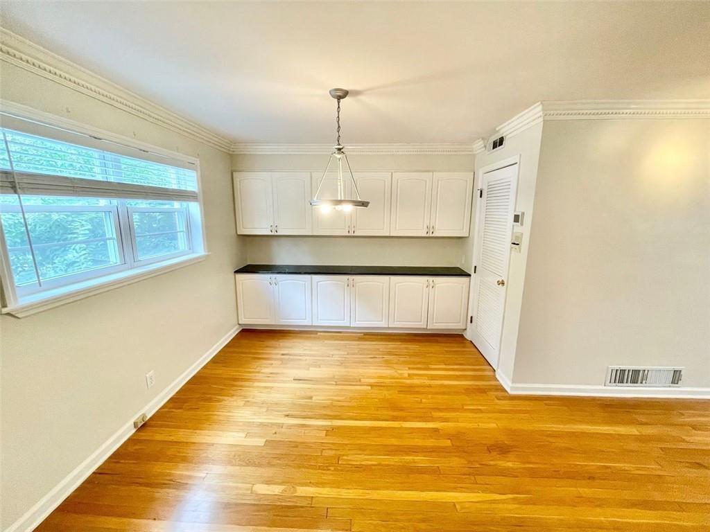 3660 Peachtree Road, Unit C3 Atlanta, GA 30319 - Photo 4 of 21 a view of a kitchen with wooden floor and a sink
