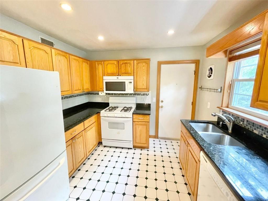 3660 Peachtree Road, Unit C3 Atlanta, GA 30319 - Photo 8 of 21 a kitchen with granite countertop appliances a sink and a window