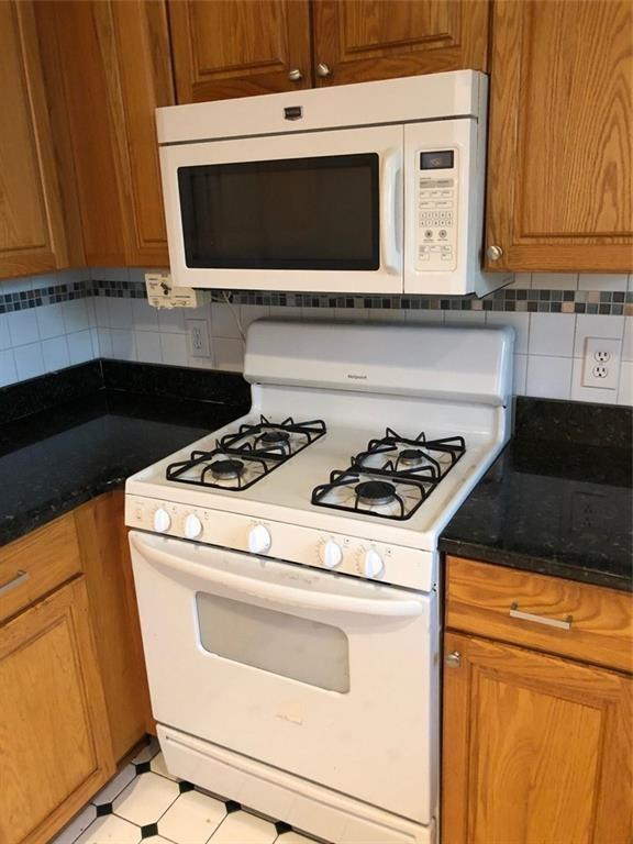 3660 Peachtree Road, Unit C3 Atlanta, GA 30319 - Photo 10 of 21 a stove top oven sitting inside of a kitchen